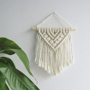 Handmade small macrame wall hanging with V-shaped tassels and wooden rod, perfect for boho home decor.”